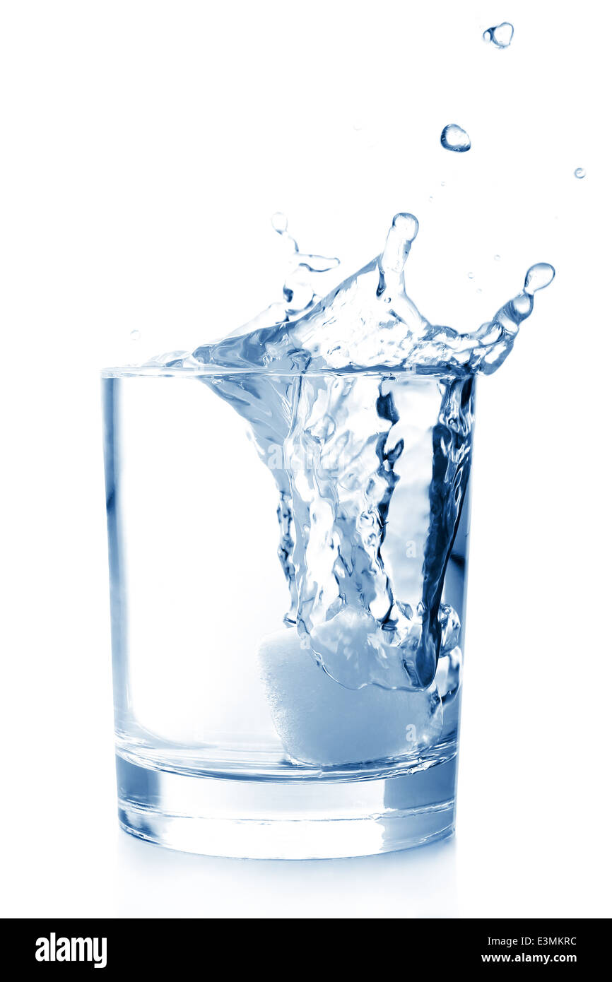 Ice in glass of water with splash on white background Stock Photo - Alamy