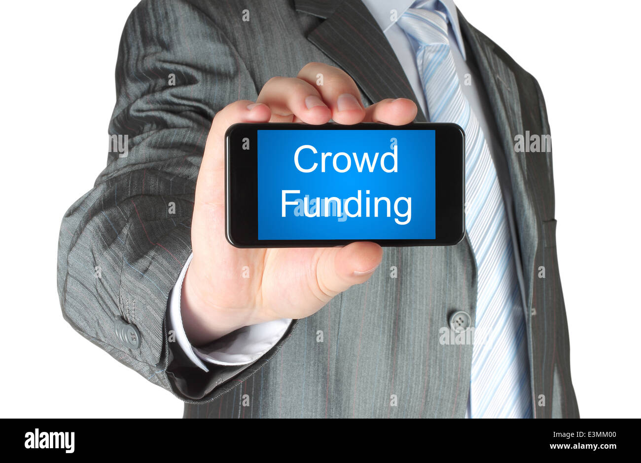 Businessman holds smart phone with crowd funding words on its screen isolated on white background. Stock Photo