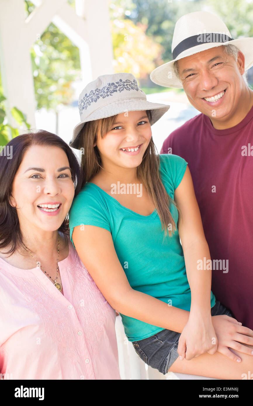 Portrait of happy grandparents and granddaughter Stock Photo
