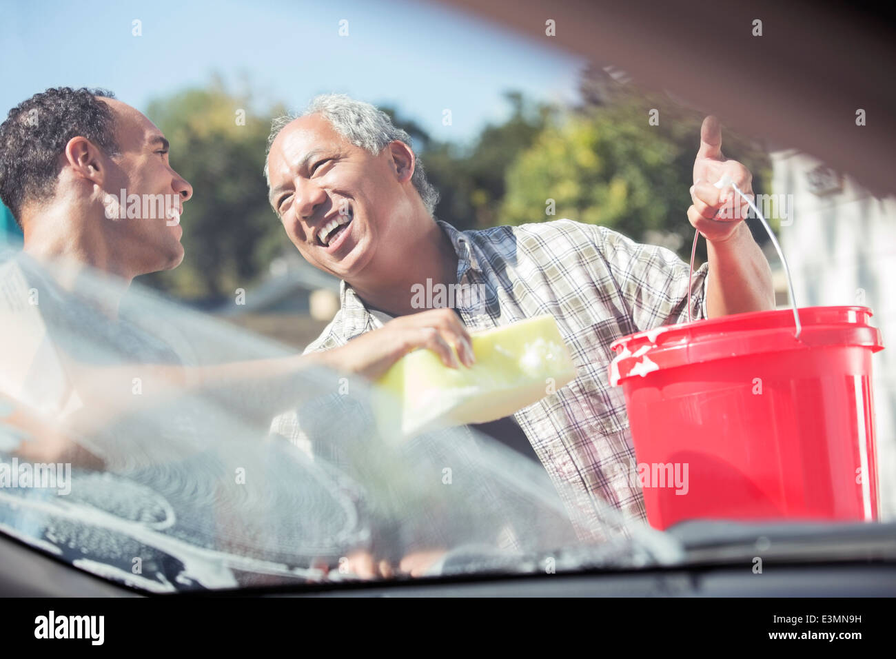 Father and son washing car Stock Photo