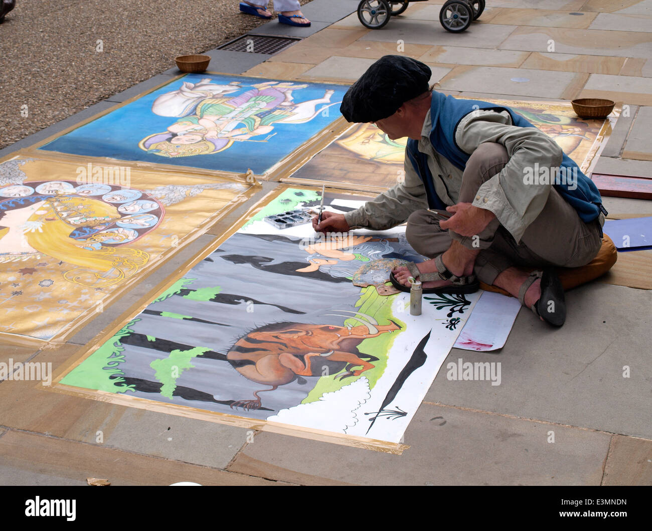 Street artist at work in Oxford city centre, UK Stock Photo