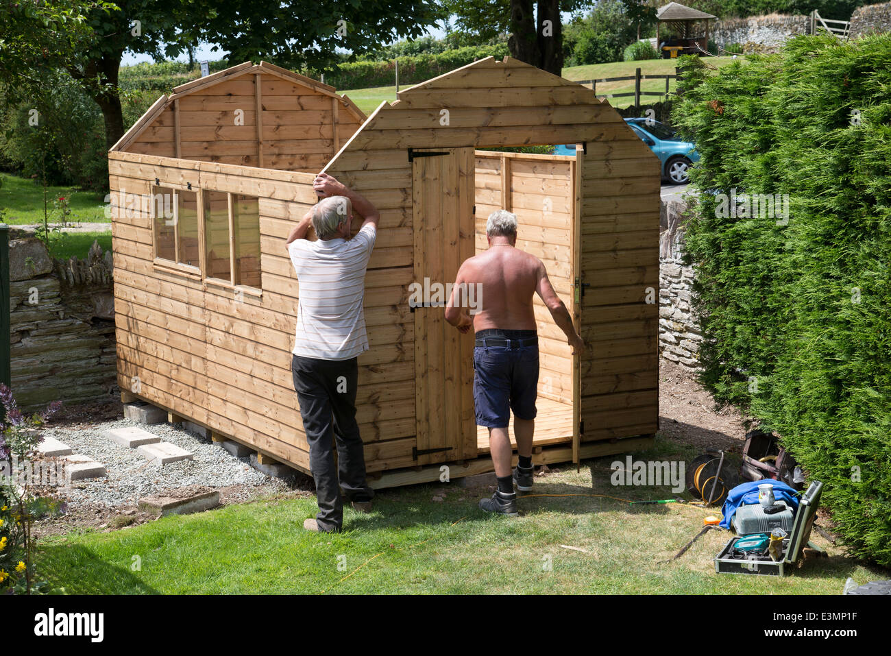 Erecting a new wooden garden shed Stock Photo