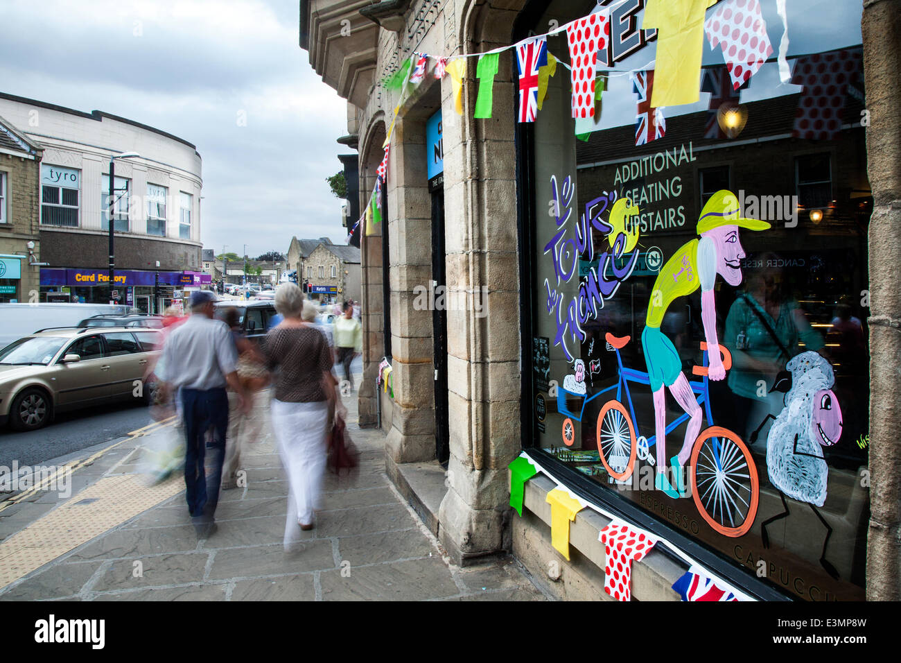 Skipton, Yorkshire Dales National Park, UK. 25th June, 2014. Bikes, Bunting and Window Art as Yorkshire prepares for Le Tour de France by decorating the route with yellow Bikes and Banners as Businesses gear up for the world's greatest cycle race - the Tour de France - which will start in the county on 5th & 6th July 2014 bringing millions of fans to the Yorkshire roadside to cheer on the champions of the sport.  It will be the first time Le Tour has visited the north of England having previously only made visits to the south coast and the capital. Credit:  Mar Photographics/Alamy Live News Stock Photo