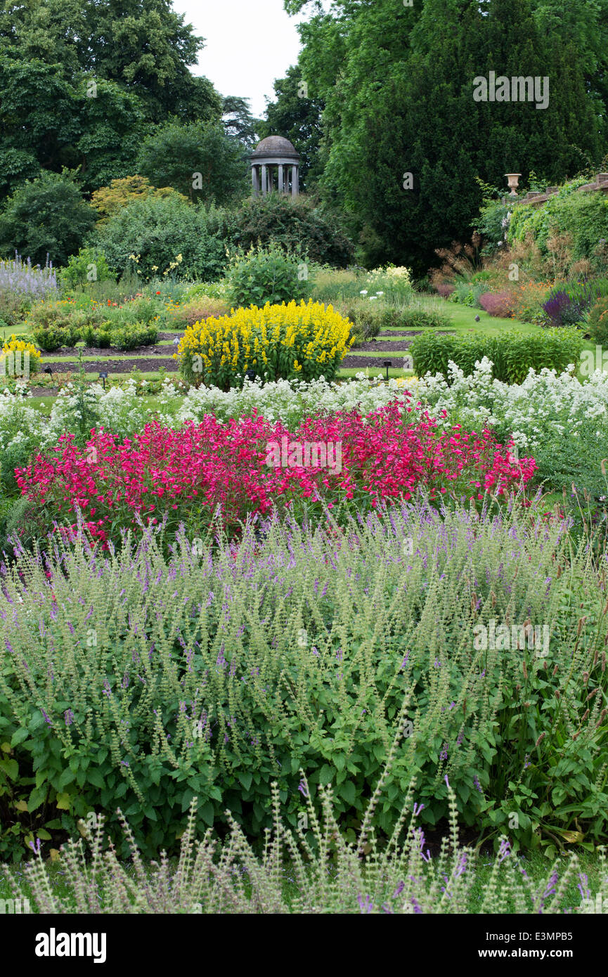 Plant family beds in the Walled Herb Garden and the Temple of Aeolus at Kew Gardens London UK Stock Photo