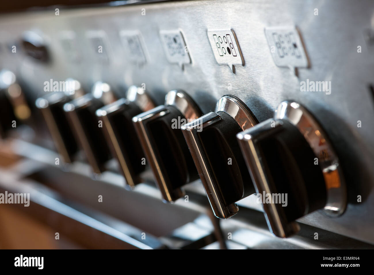 The control knobs on the front of a gas range cooker Stock Photo