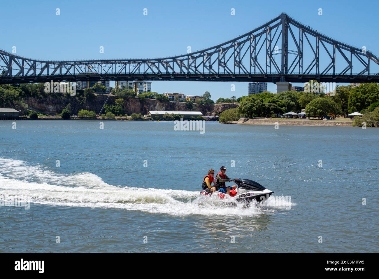 Brisbane Australia,Brisbane River,Story Bridge,wave runner,jet ski,man men male,riding,passenger passengers rider riders,AU140316013 Stock Photo