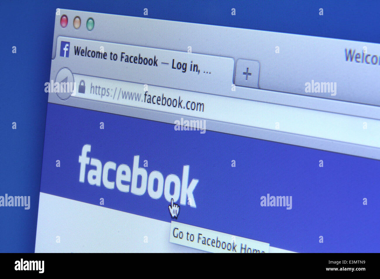 Facebook homepage on a monitor screen. Facebook is the world’s largest social network Stock