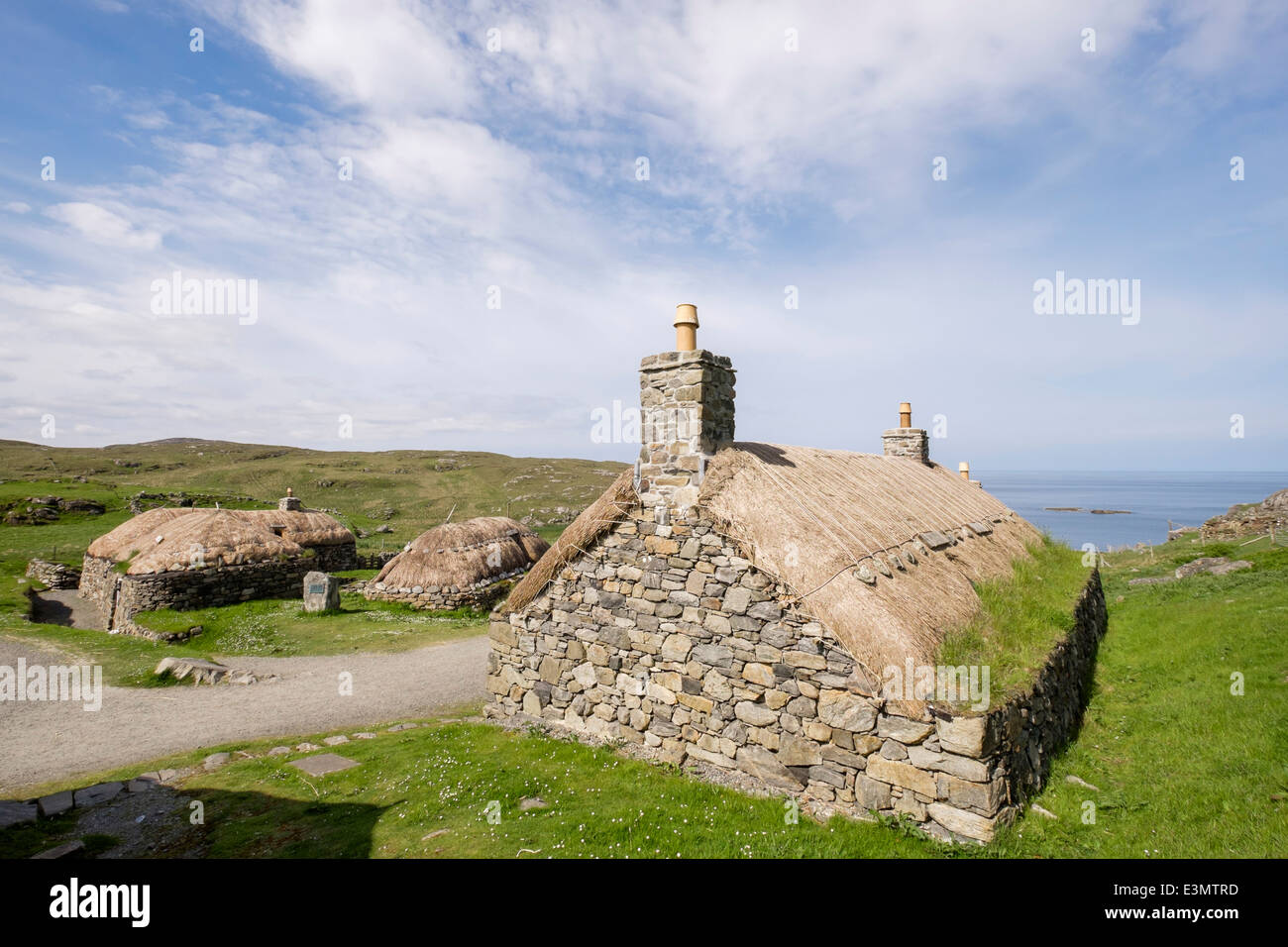 Restored thatched blackhouses crofts in Na Gearrannan Blackhouse Village museum on west coast. Garenin Carloway Isle of Lewis Outer Hebrides Scotland Stock Photo