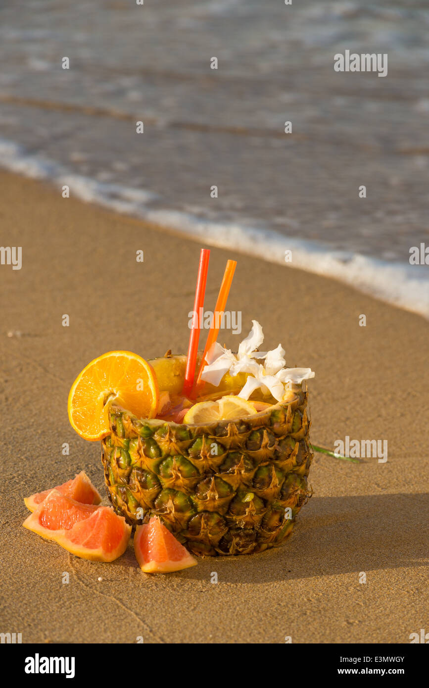 Fruity drink served inside a pineapple shell Stock Photo Alamy