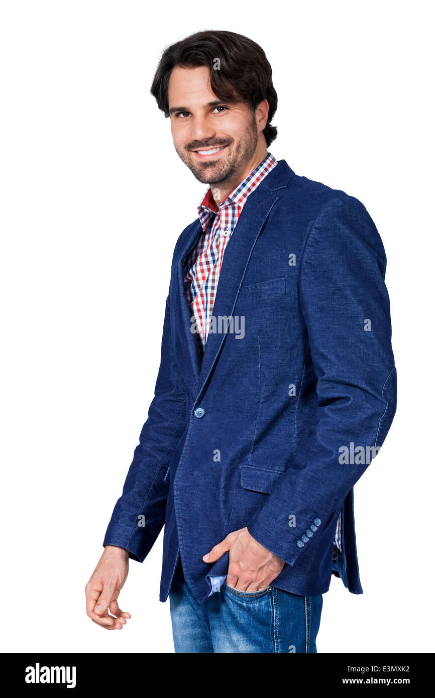 Handsome smiling man in stylish leisurewear approaching the camera in a relaxed posture with his hand in his pocket, isolated on Stock Photo
