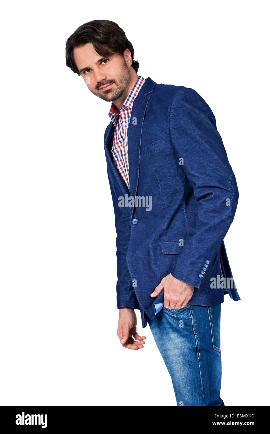 Handsome smiling man in stylish leisurewear approaching the camera in a relaxed posture with his hand in his pocket, isolated on Stock Photo