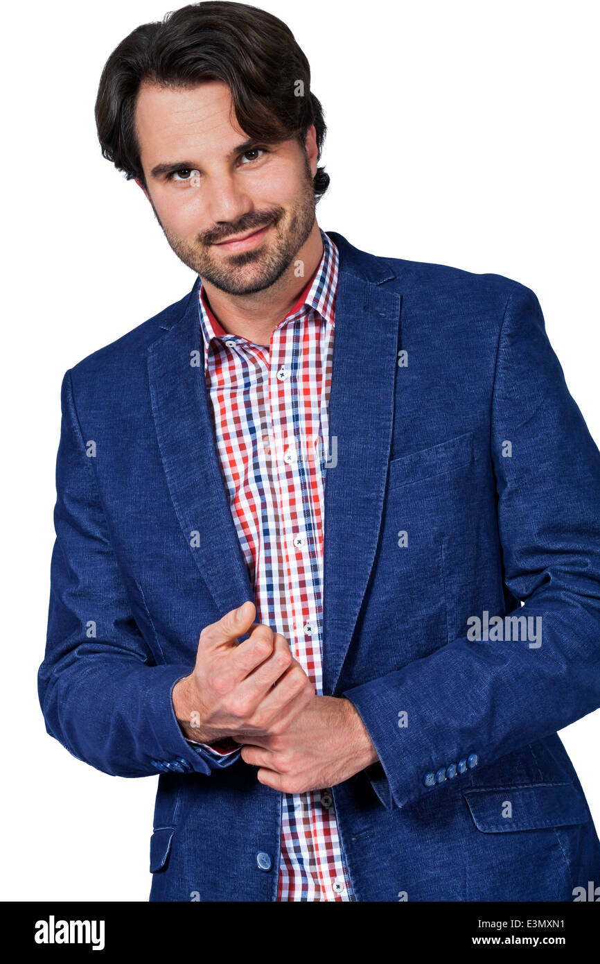 Handsome smiling man in stylish leisurewear approaching the camera in a relaxed posture with his hand in his pocket, isolated on Stock Photo