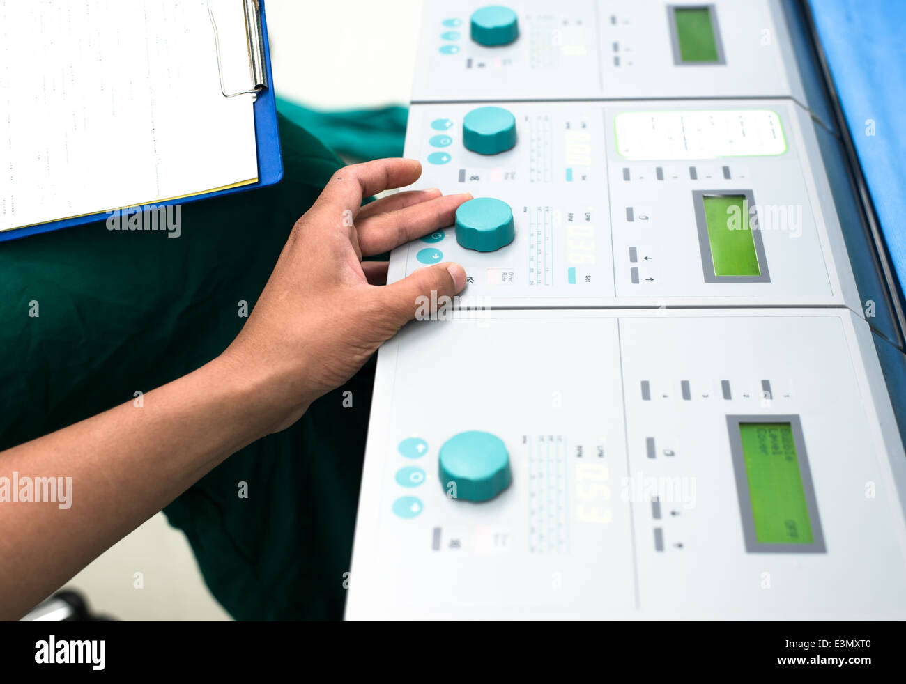 Perfusionist control heart lung machine in operating room Stock Photo