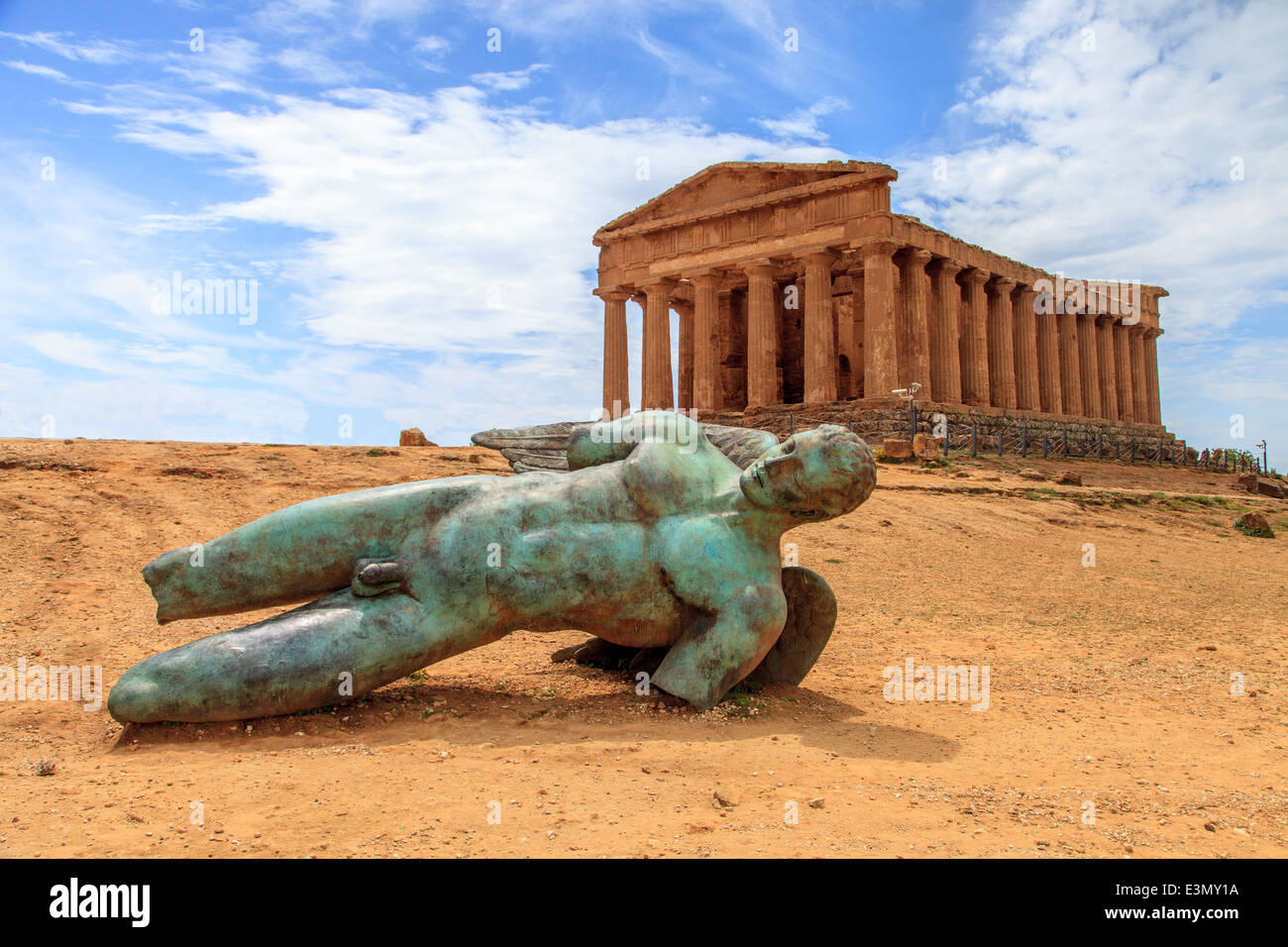 A big statue of Icaro in front of a Greek Temple  in Valley of Temples Stock Photo