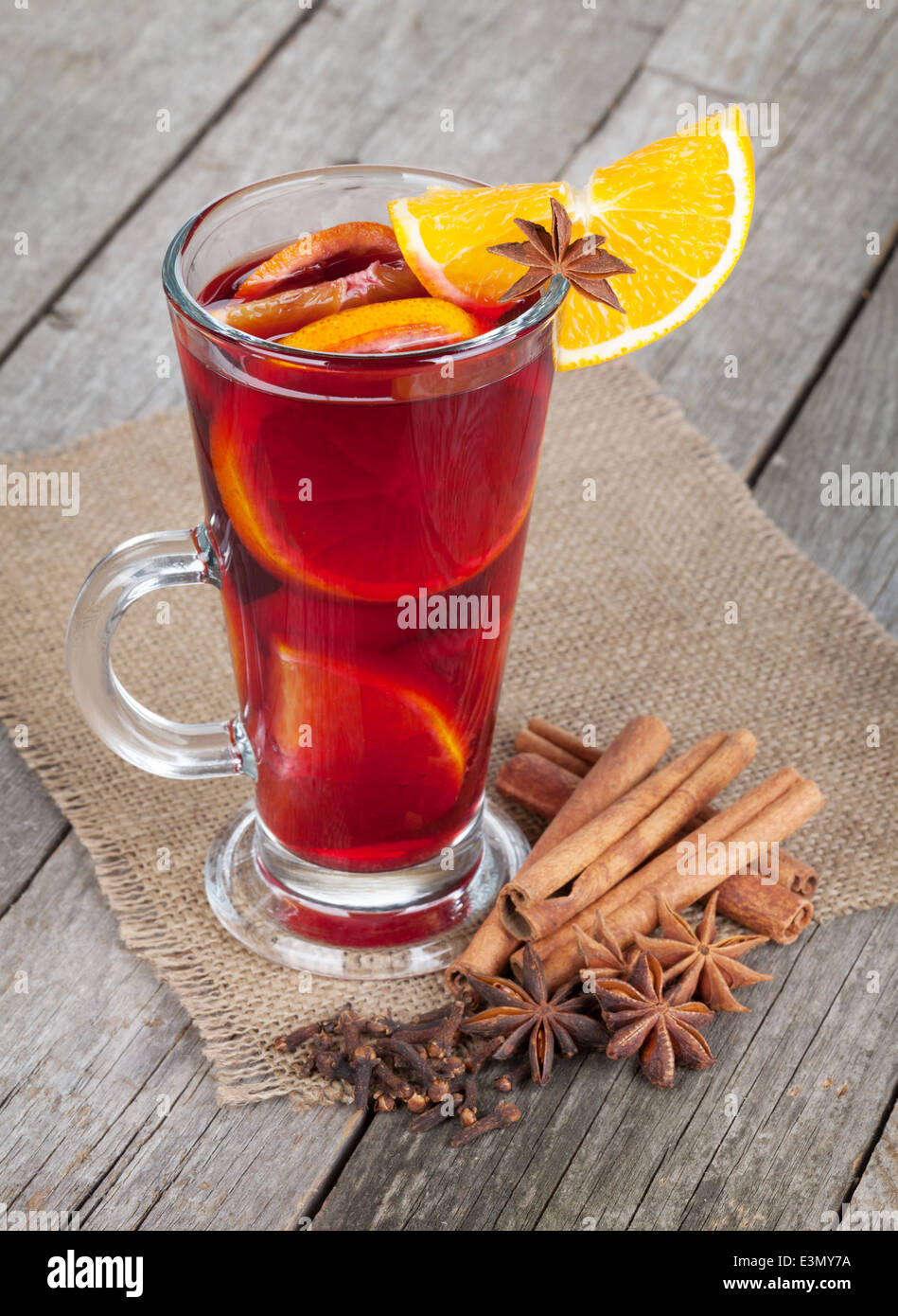 Christmas mulled wine with spices on wooden table Stock Photo