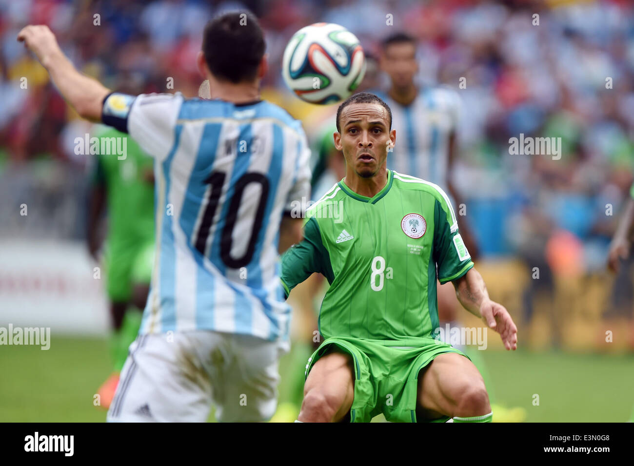 Porto Alegre, Brazil. 25th June, 2014. PORTO ALEGRE BRAZIL -15 Jun: Leo Messi and Peter Odemwingie in the match between Argentina and Nigeria, corresponding to the group F of the World Cup 2014, played at the Beira Rio stadium, on June 25, 2014. Photo: Edu Andrade/Urbanandsport/Nurphoto Credit:  Edu Andrade/NurPhoto/ZUMAPRESS.com/Alamy Live News Stock Photo