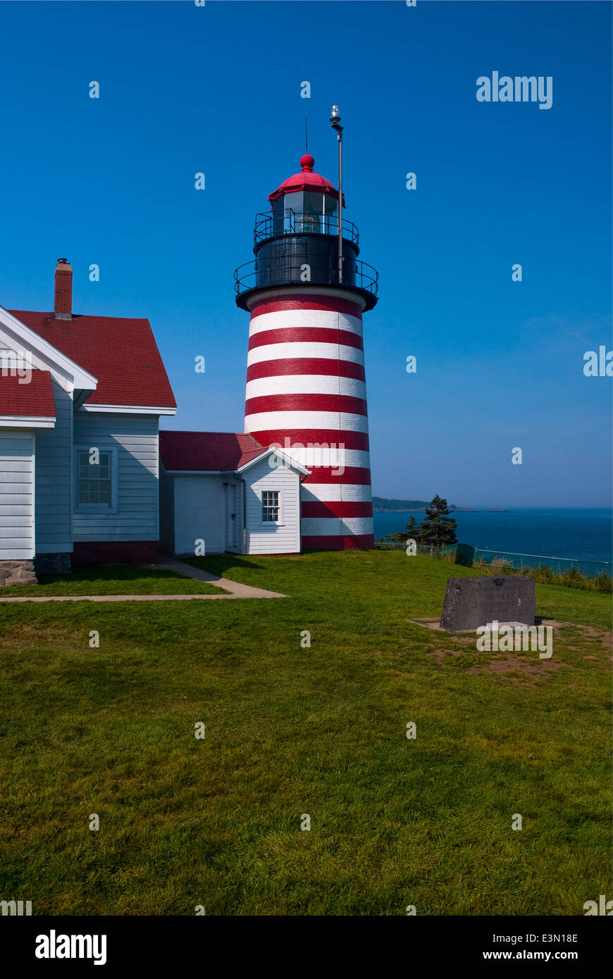 West Quoddy Head Lighthouse is located inside the Quoddy Head State Park system of trails. Stock Photo