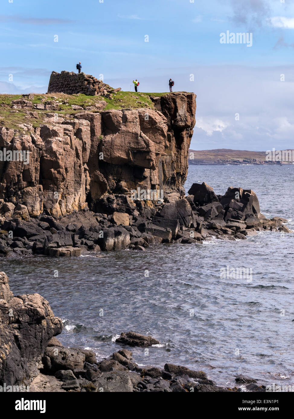 Ruins of ancient Scottish coastal promontory fort ( Dun ) at Rubha an Dunain headland, Glenbrittle, Isle of Skye, Scotland, UK Stock Photo