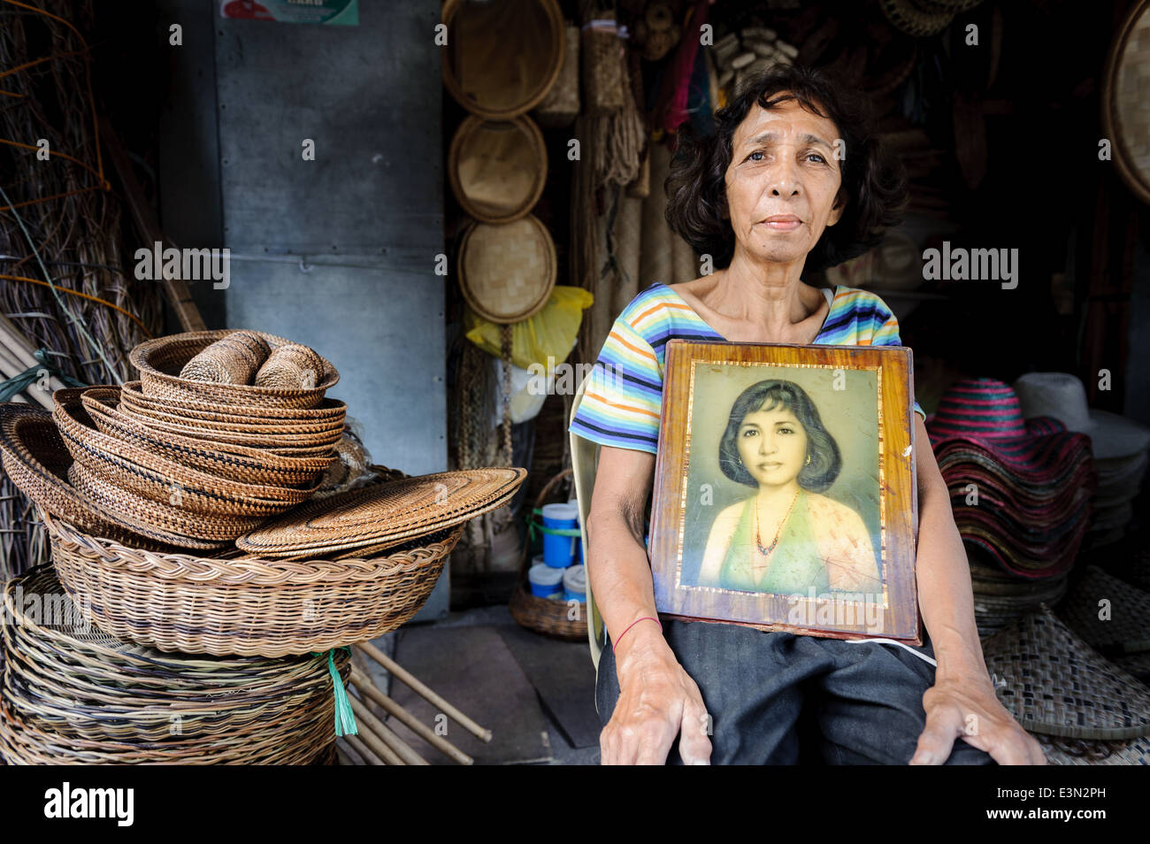 Woman with her own portrait, Philipppines Stock Photo