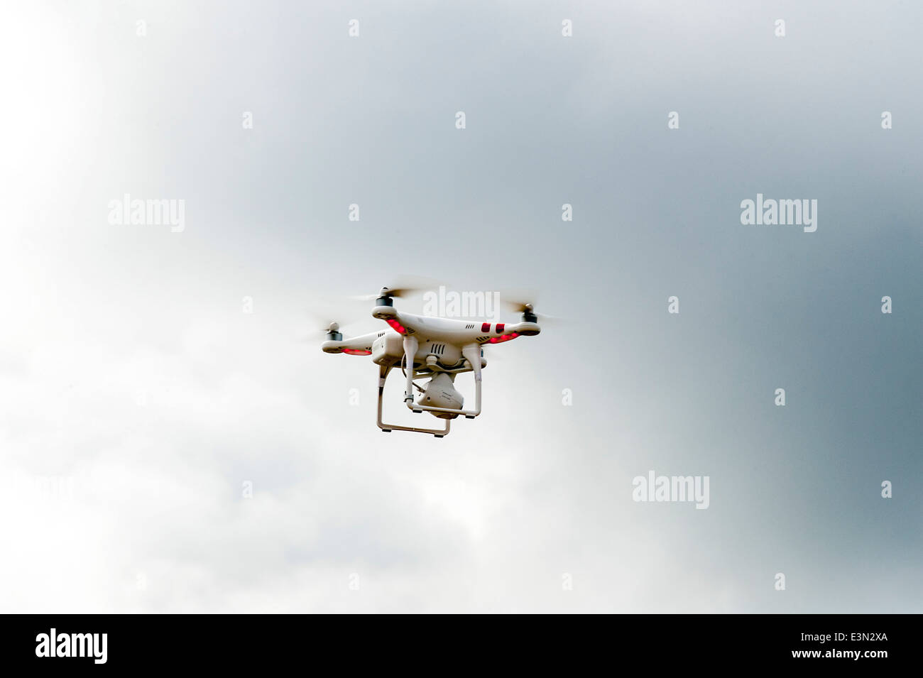Radio remote controlled camera drone hovering in flight over Lough