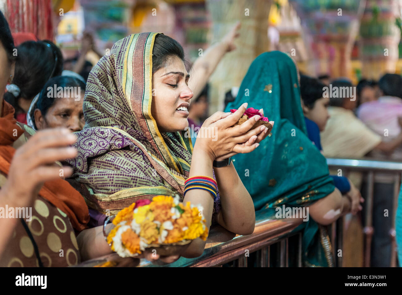 Woman crying during celebration of Holi, Mathura, India Stock Photo