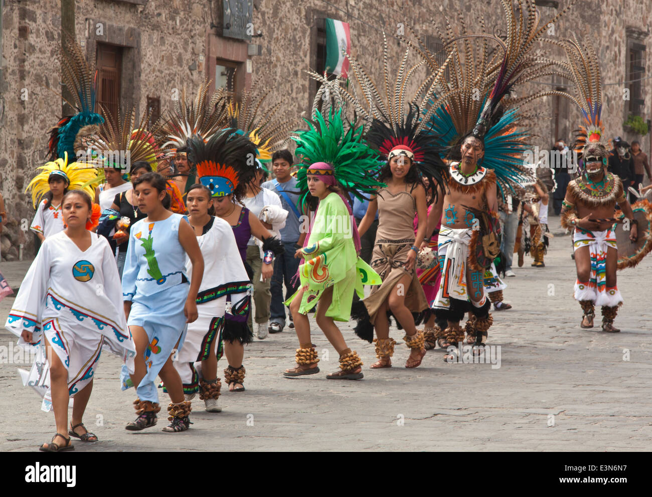 DANCE TROUPES from all over MEXICO parade through the streets of San Miguel Arcangel, the patron saint of SAN MIGUEL DE ALLENDE Stock Photo