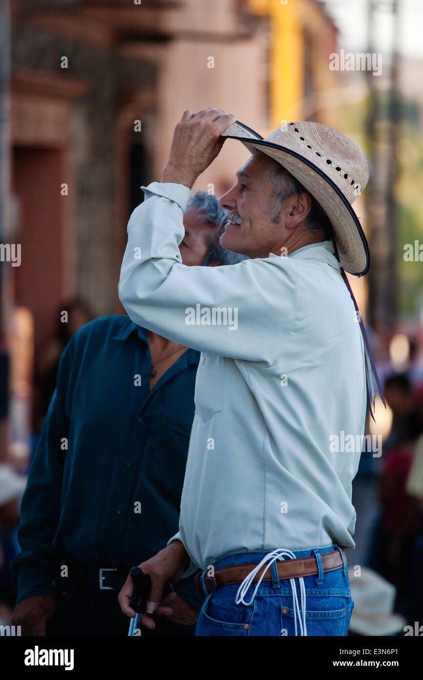 A COWBOY at the DIA DE LOS LOCOS (DAY OF THE CRAZIES) celebration - SAN MIGUEL DE ALLENDE, GUANAJUATO, MEXICO Stock Photo