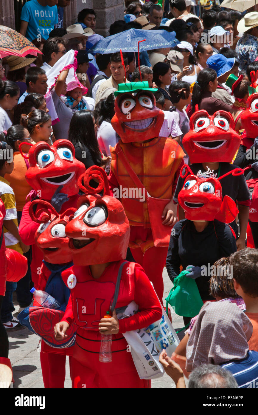 Mexicans dress in costumes and participate the DIA DE LOS LOCOS PARADE - SAN MIGUEL DE ALLENDE, GUANAJUATO, MEXICO Stock Photo