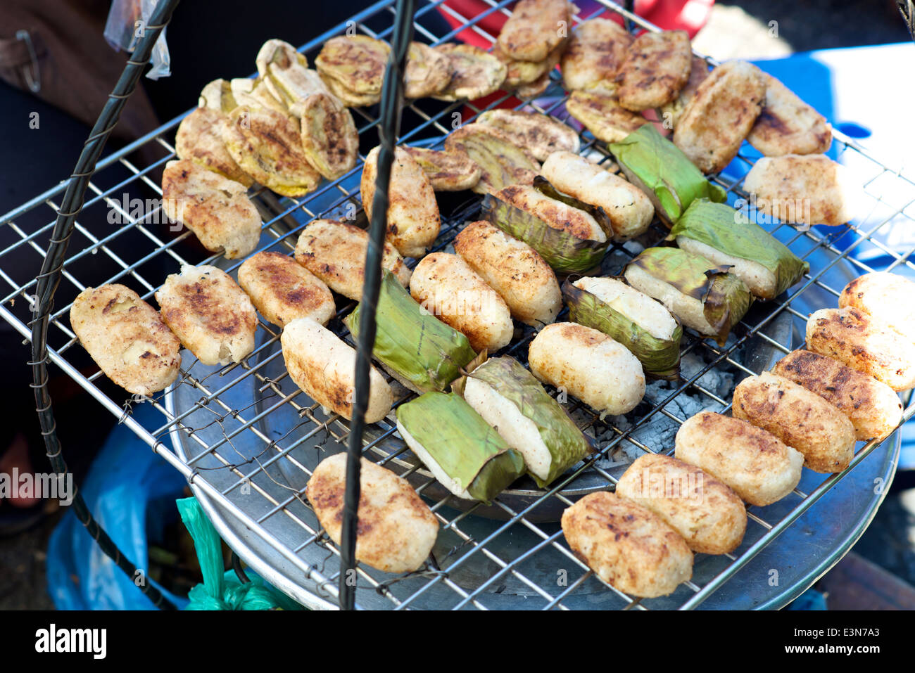 Vietnamese specialty Banana Rice Cake wrapped in leaves grilled Stock Photo