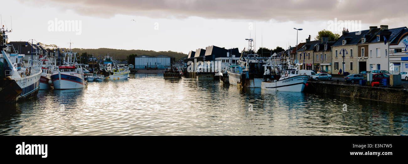 Commercial fishing boats docked along the quay in Port-en-Bessin, Normandy, France Stock Photo