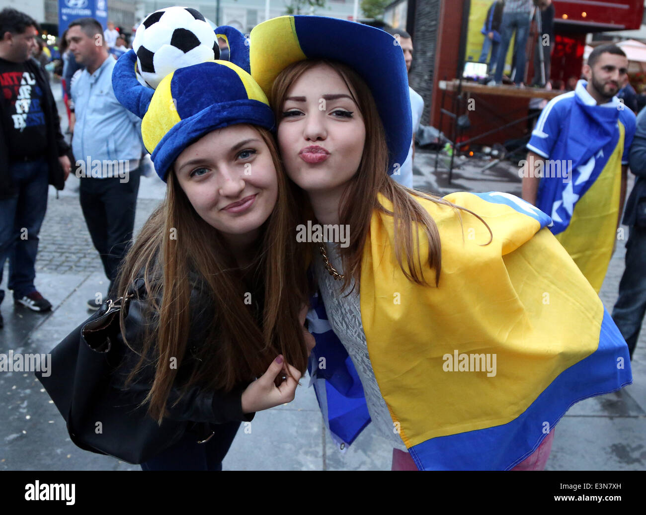 Sarajevo, Bosnia Herzegovina. 25th June, 2014. Fans cheer for the team as they watch the televised 2014 FIFA World Cup Group F match between Bosnia and Herzegovina and Iran, in front of the BBI Center at downtown Sarajevo, Bosnia Herzegovina, on June 25, 2014. Bosnia and Herzegovina won the match 3-1 but was disqualified for the knockout stage. © Haris Memija/Xinhua/Alamy Live News Stock Photo