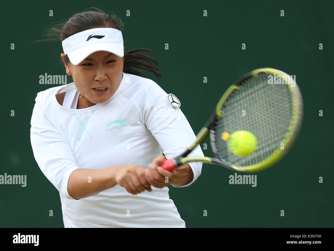 London, Britain. 25th June, 2014. Peng Shuai of China competes during the women's singles second round match against Maria Kirilenko of Russia at the 2014 Wimbledon Championships in Wimbledon, southwest London, Britain, on June 25, 2014. Peng Shuai won 2-0. Credit:  Meng Yongmin/Xinhua/Alamy Live News Stock Photo