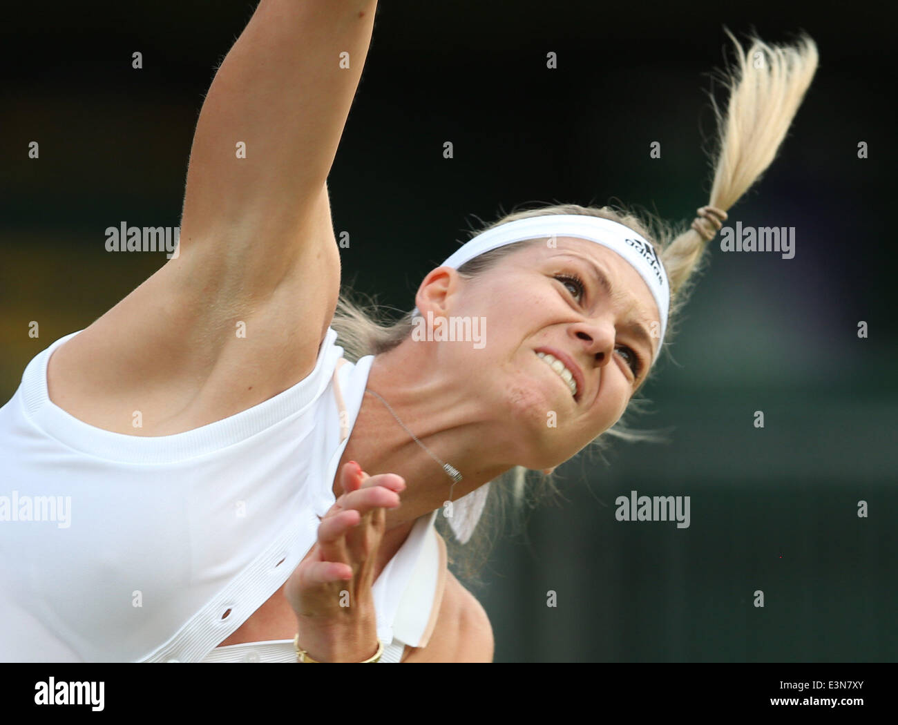 London, Britain. 25th June, 2014. Maria Kirilenko of Russia serves during the women's singles second round match against Peng Shuai of China at the 2014 Wimbledon Championships in Wimbledon, southwest London, Britain, on June 25, 2014. Peng Shuai won 2-0. Credit:  Meng Yongmin/Xinhua/Alamy Live News Stock Photo
