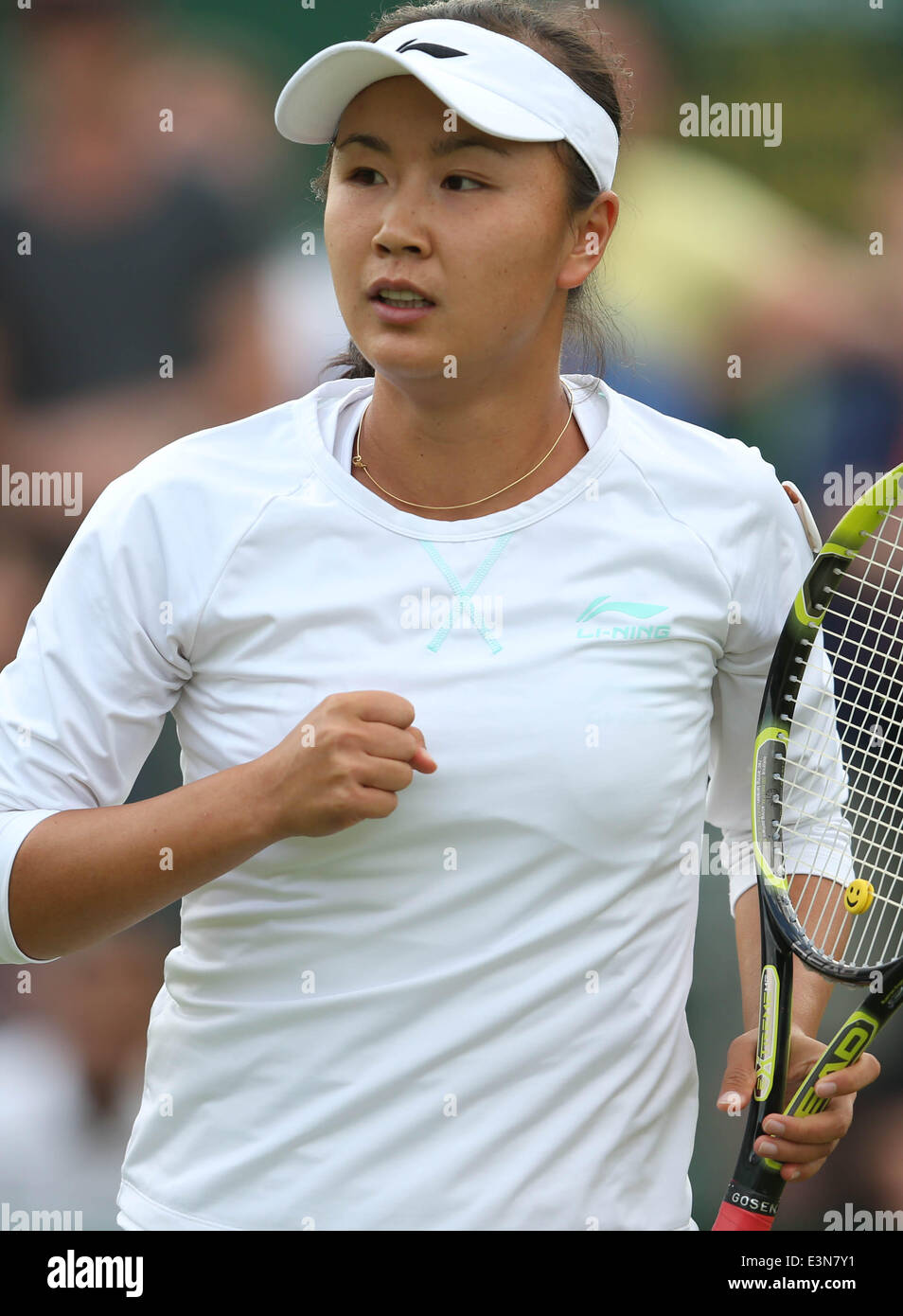 London, Britain. 25th June, 2014. Peng Shuai of China celebrates during the women's singles second round match against Maria Kirilenko of Russia at the 2014 Wimbledon Championships in Wimbledon, southwest London, Britain, on June 25, 2014. Peng Shuai won 2-0. Credit:  Meng Yongmin/Xinhua/Alamy Live News Stock Photo