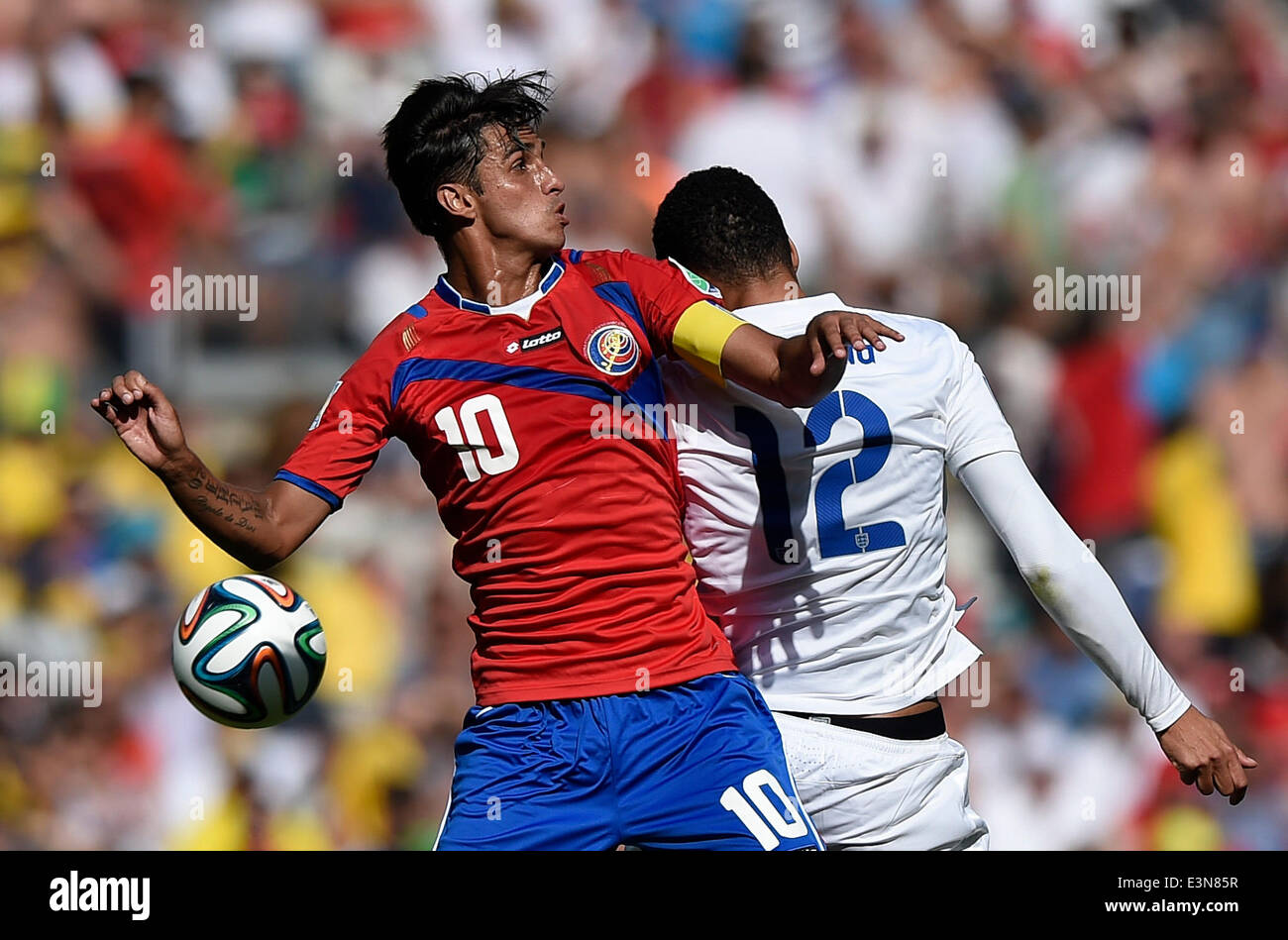 Belo Horizonte, Brazil. 24th June, 2014. Costa Rica's Bryan Ruiz (L) vies with England's Chris Smalling during a Group D match between Costa Rica and England of 2014 FIFA World Cup at the Estadio Mineirao Stadium in Belo Horizonte, Brazil, on June 24, 2014. England drew 0-0 with Costa Rica on Tuesday. Credit:  Qi Heng/Xinhua/Alamy Live News Stock Photo