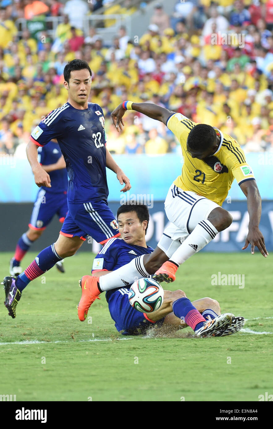Cuiaba, Brazil. 24th June, 2014. Colombia's Jackson Martinez (R) vies for the ball during a Group C match between Japan and Colombia of 2014 FIFA World Cup at the Arena Pantanal Stadium in Cuiaba, Brazil, June 24, 2014. © Liu Dawei/Xinhua/Alamy Live News Stock Photo