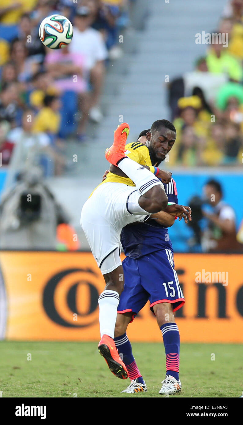 Cuiaba, Brazil. 24th June, 2014. Colombia's Jackson Martinez (front) vies for the ball during a Group C match between Japan and Colombia of 2014 FIFA World Cup at the Arena Pantanal Stadium in Cuiaba, Brazil, June 24, 2014. © Li Ming/Xinhua/Alamy Live News Stock Photo