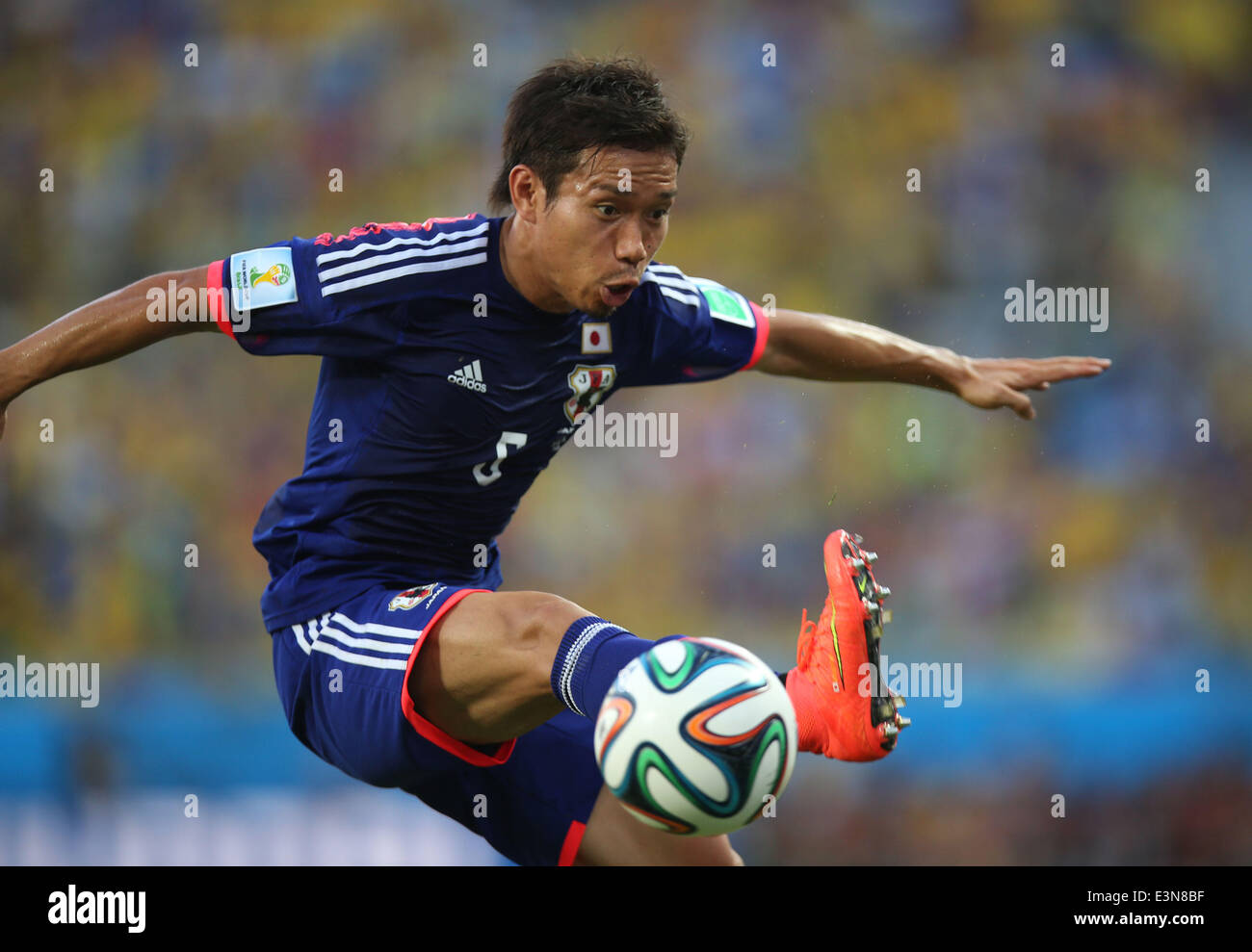 Cuiaba, Brazil. 24th June, 2014. Japan's Yuto Nagatomo stops the ball during a Group C match between Japan and Colombia of 2014 FIFA World Cup at the Arena Pantanal Stadium in Cuiaba, Brazil, June 24, 2014. © Li Ming/Xinhua/Alamy Live News Stock Photo