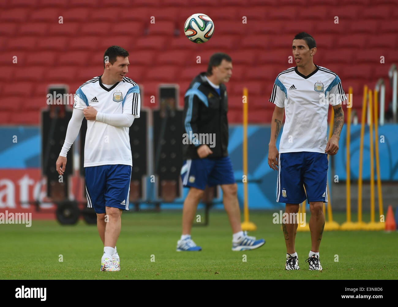 Porto Alegre, Brazil. 24th June, 2014. Argentina's Lionel Messi (L) and Angel Di Maria (R) are seen in a training session at the Estadio Beira-Rio Stadium ahead of a Group F match between Argentina and Nigeria of 2014 FIFA World Cup, in Porto Alegre, Brazil, June 24, 2014. Credit:  Li Ga/Xinhua/Alamy Live News Stock Photo