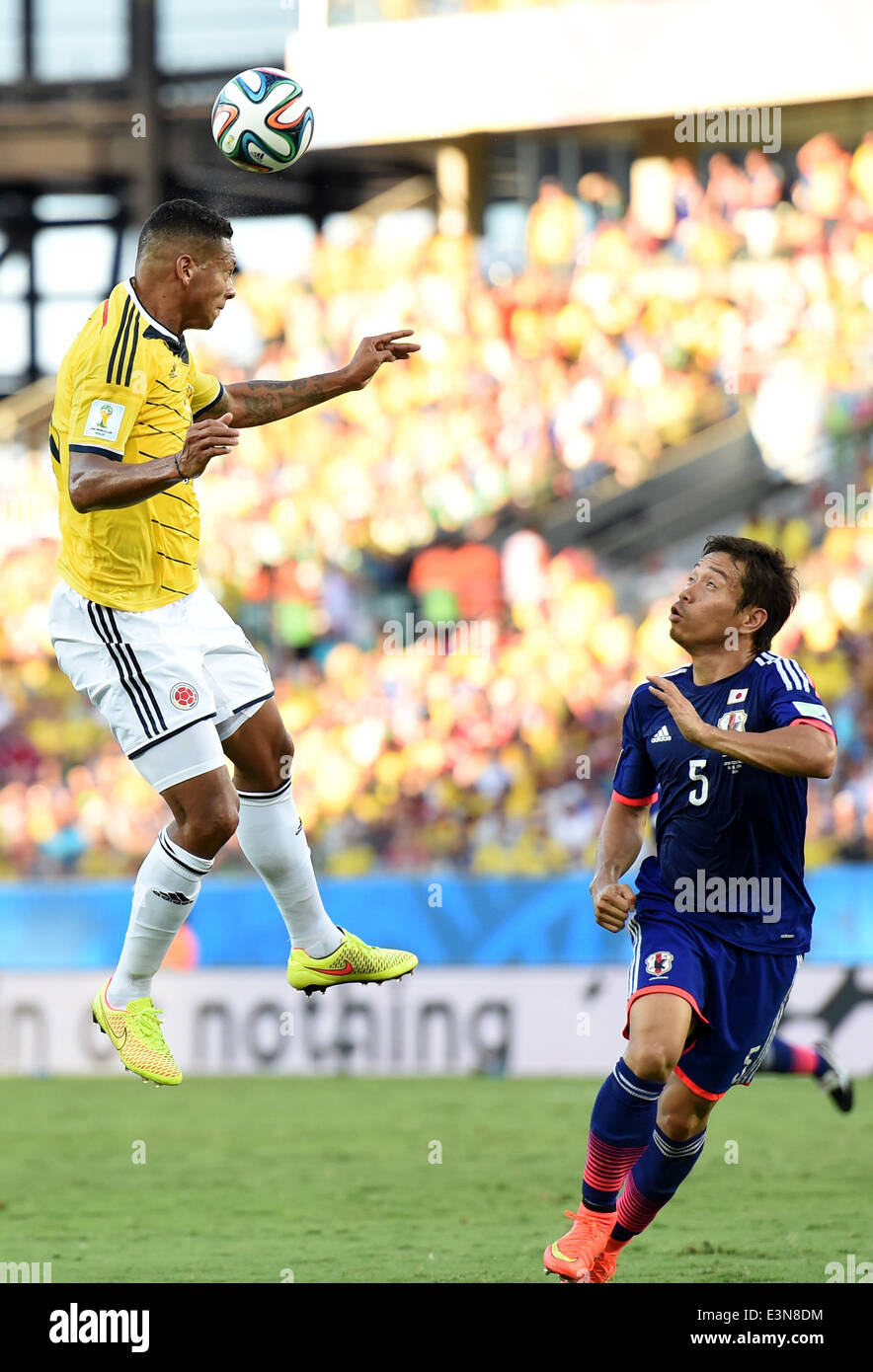 Cuiaba, Brazil. 24th June, 2014. Colombia's Freddy Guarin jumps for a ball during a Group C match between Japan and Colombia of 2014 FIFA World Cup at the Arena Pantanal Stadium in Cuiaba, Brazil, June 24, 2014. © Liu Dawei/Xinhua/Alamy Live News Stock Photo