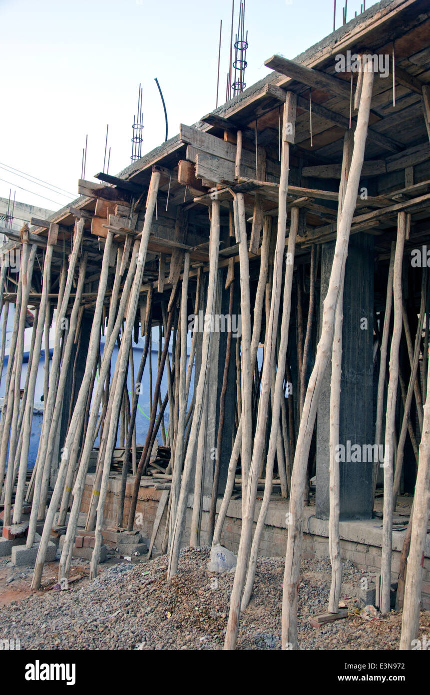 Wooden scaffolding around new building in asia, India Stock Photo