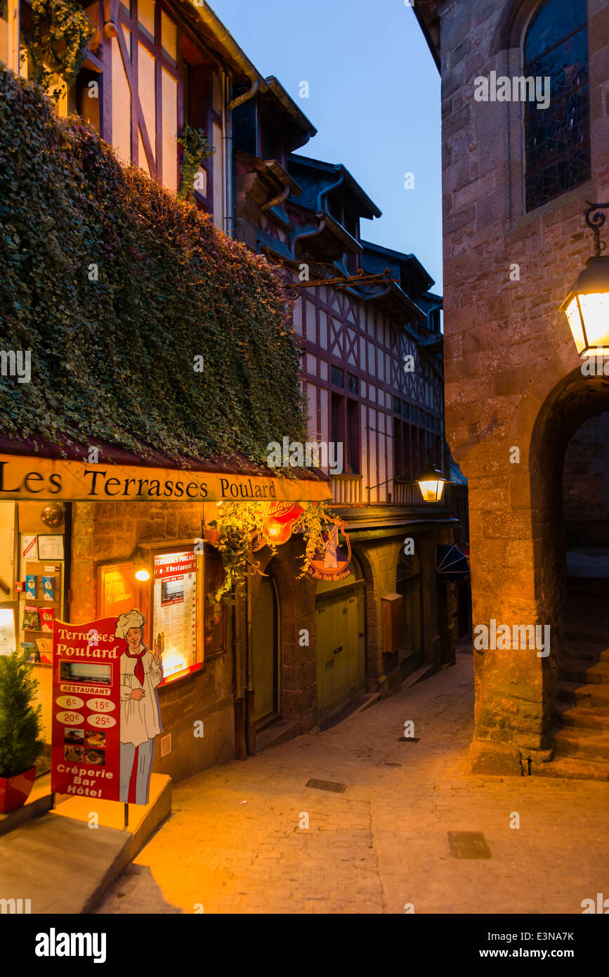 Les Terrasses Poulard restaurant and hotel in the late evening, Mont Saint Michel, France Stock Photo