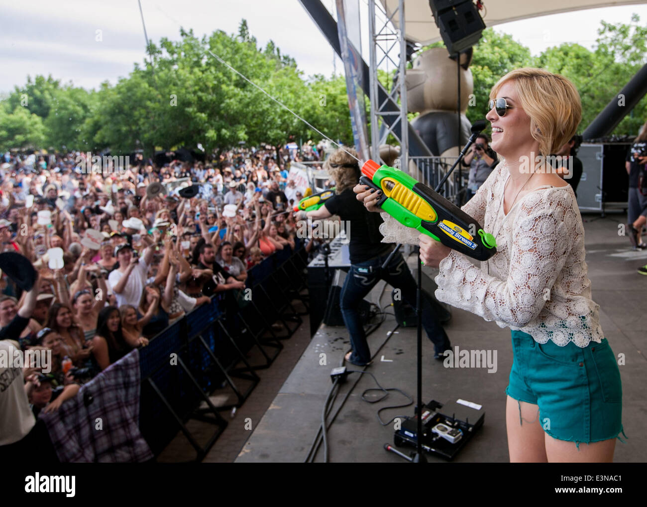 Stockton, CA, USA. 21st June, 2014. Maggie Rose squirts the crowd with