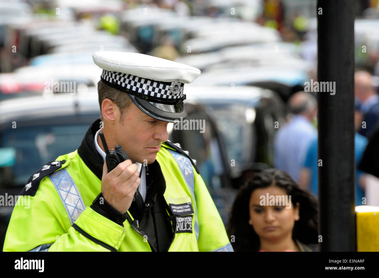 London, England, UK. Metropolitan police Chief Inspector on duty during a taxi drivers' protest in central London, June 11 2014 Stock Photo