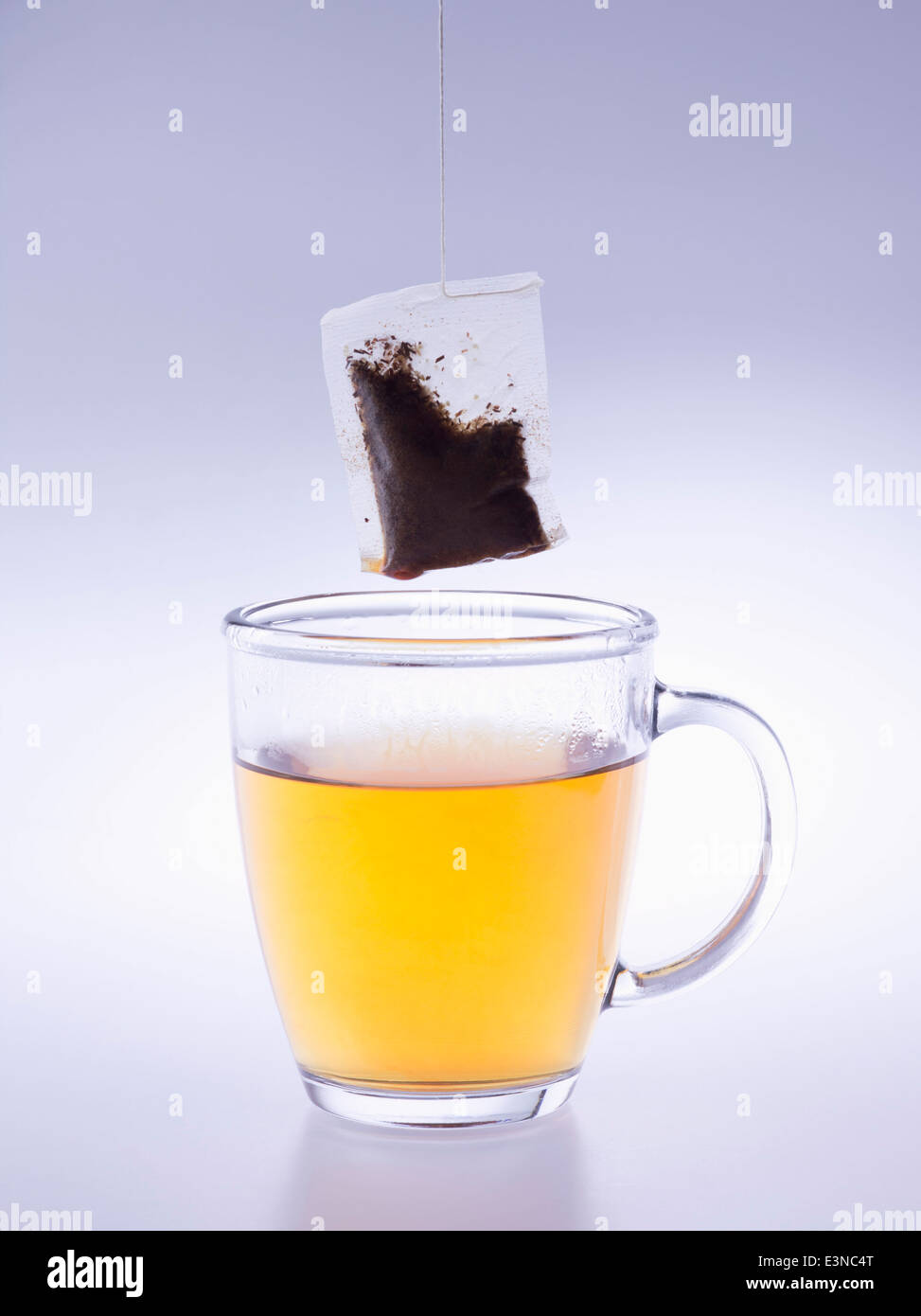 Herbal tea cup and teabag over blue background Stock Photo