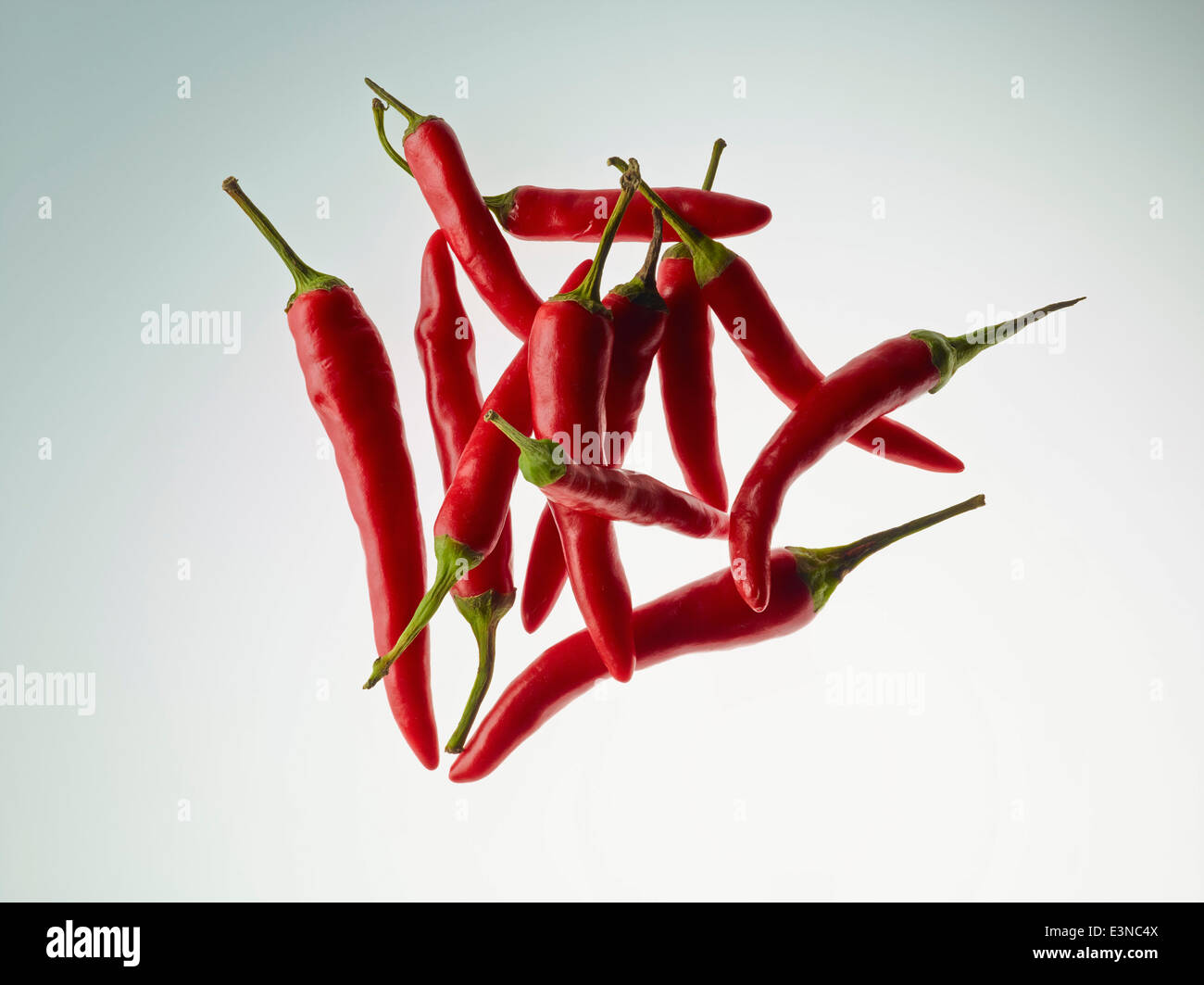 Red chilies over gray background Stock Photo Alamy