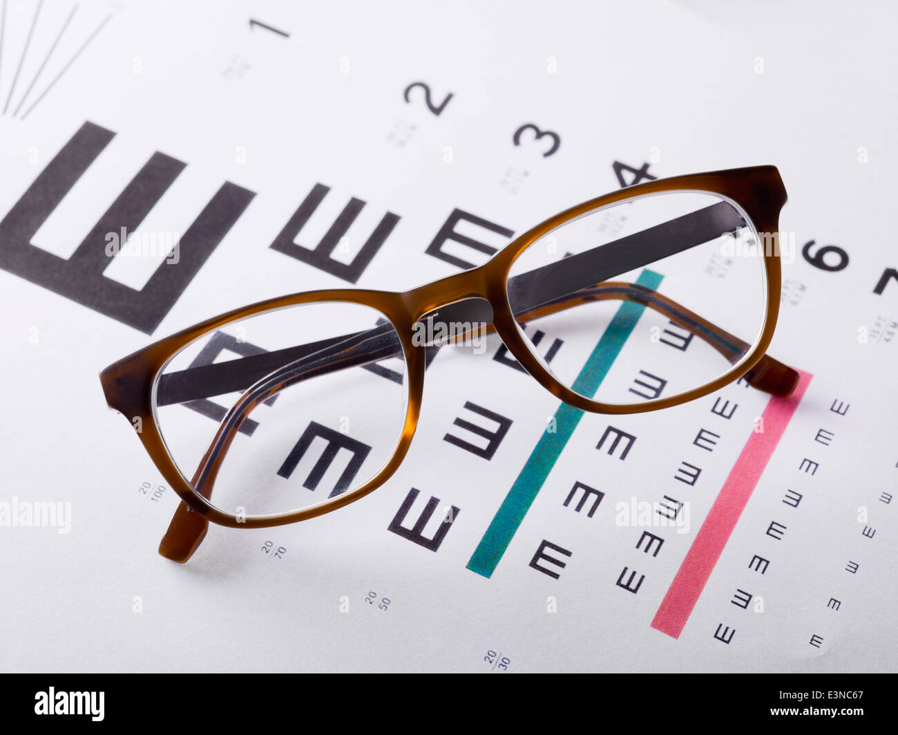 Eyeglasses on medical exam chart Stock Photo