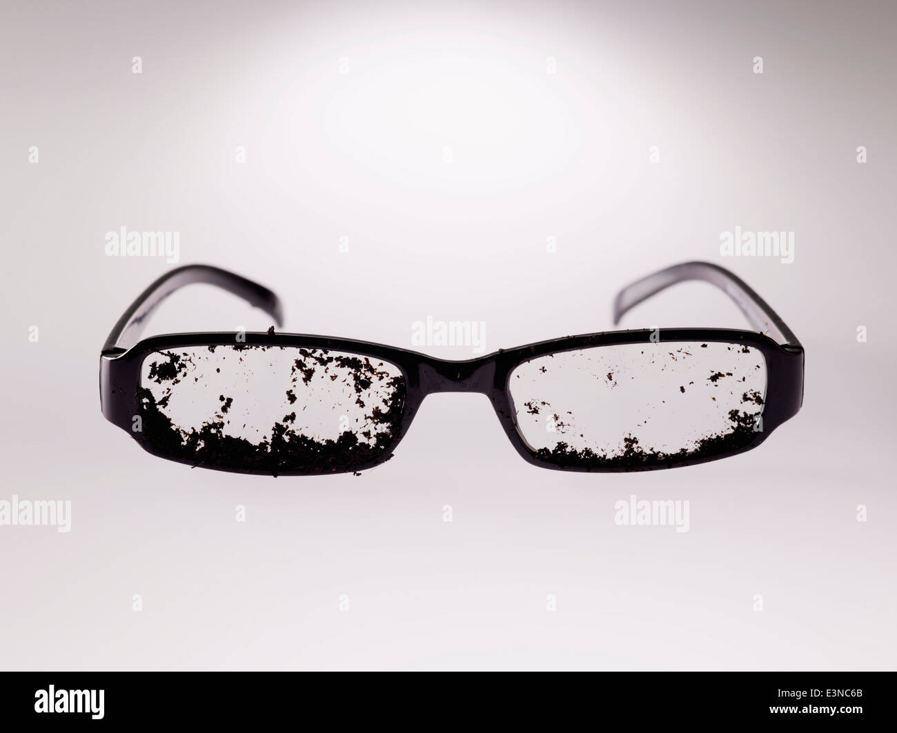 Dirty eyeglasses over gray background Stock Photo