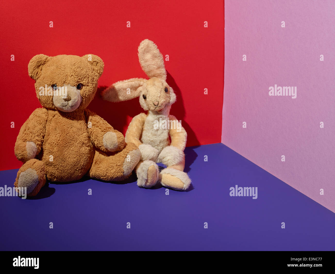 Teddy bears on floor in colorful room Stock Photo