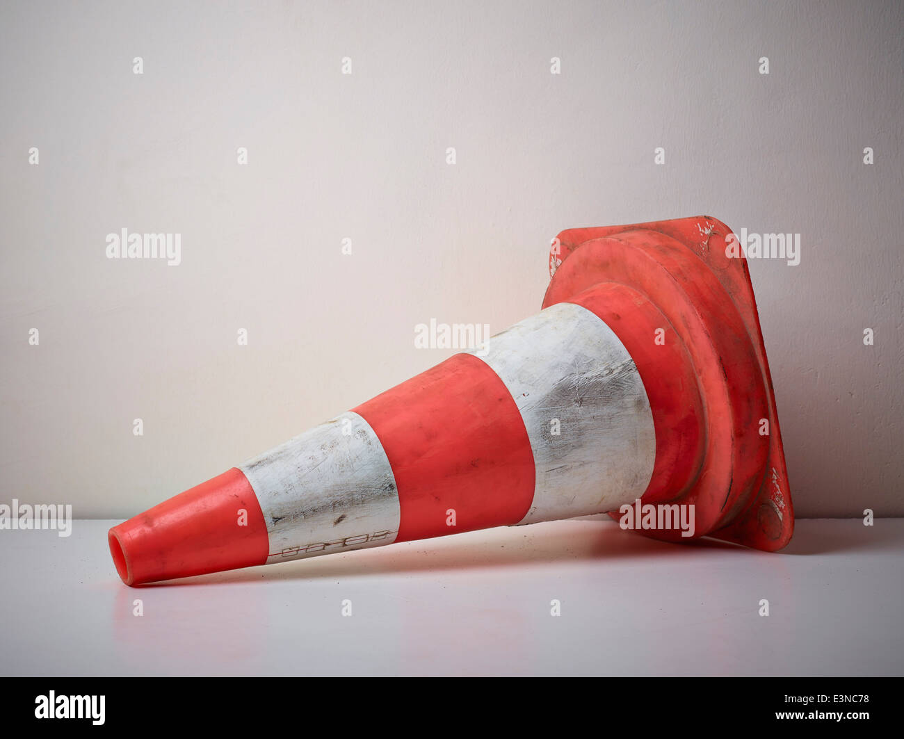 Traffic cone fallen on floor Stock Photo